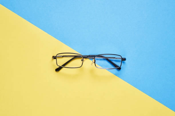 istock Eyewear placed on a pastel yellow and blue background divides the halves. 914333584