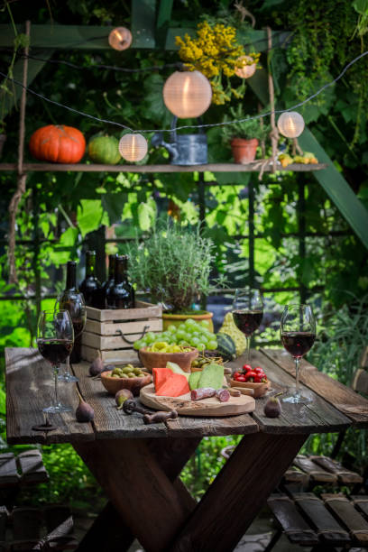 istock Preparation for dinner with wine and fruits in the evening 914336122