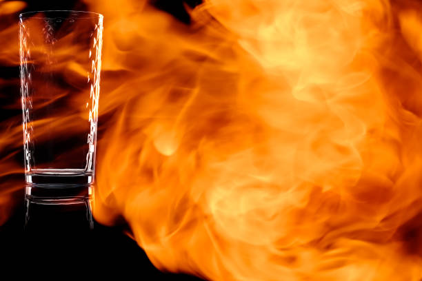 istock Faceted empty glass of water in the fire flames. 914336380