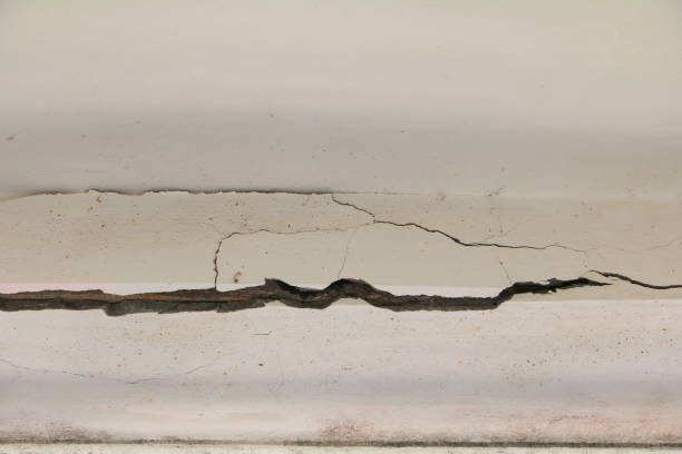 istock concrete cement texture wall  with crack in building old background 914336616