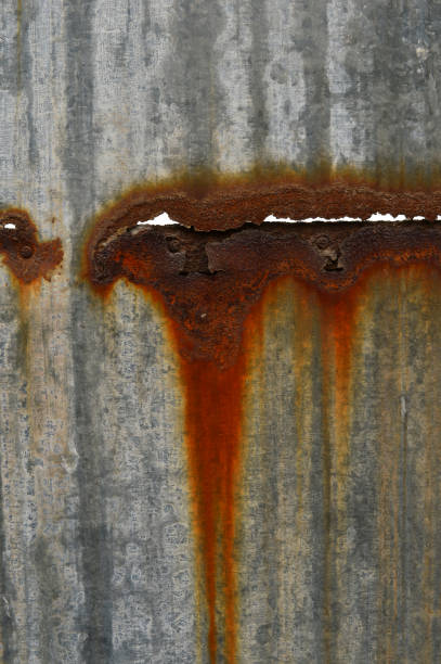 istock The background of the rusty metal hole peeling paint 914349236