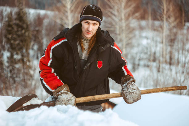istock the guy with the shovel throws the snow 914351968
