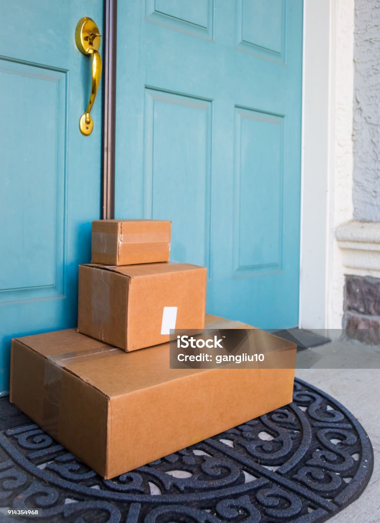 on line shopping Boxes delivered to front door Box - Container Stock Photo