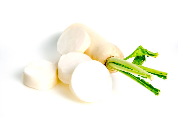 Fresh Daikon radish with sliced pieces isolated on white background