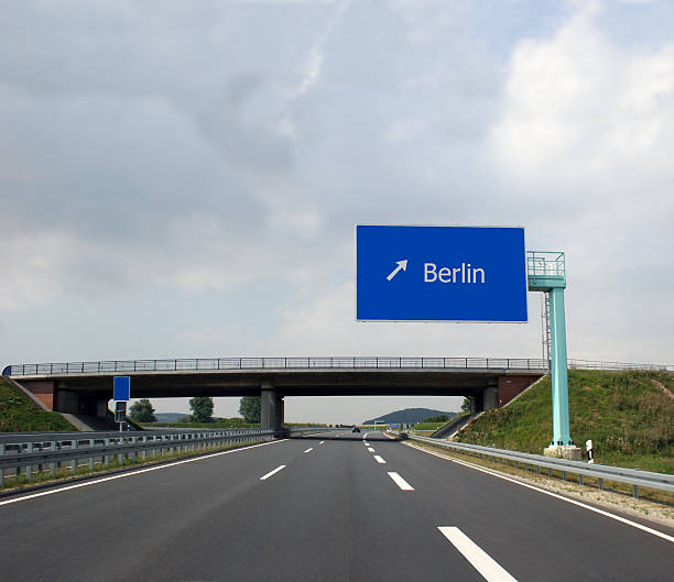 An arrow sign indicating a motorway ahead - macro image.