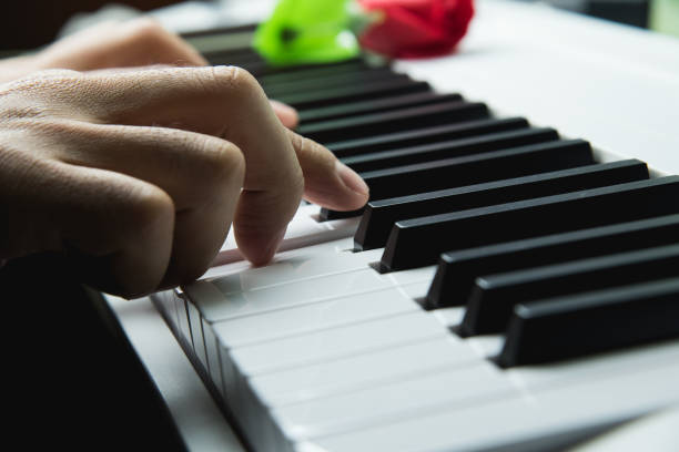 istock Defocusing hands on the keyboard of the piano 914388284