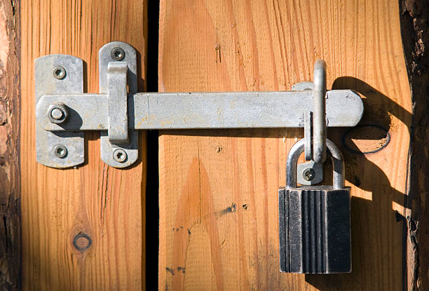 istock padlock on wooden door 91439840