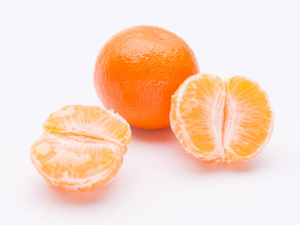 istock Whole and half of mandarin oranges isolated on white background 914399600