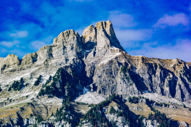 istock Low Angle View Of Rocky Mountains Against Blue Sky 914415626
