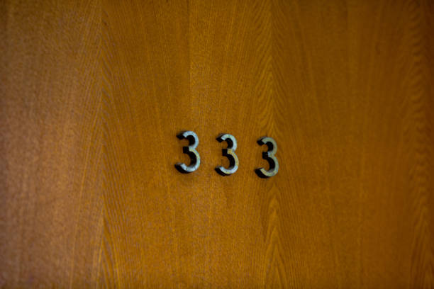 istock figures on a wooden door 914416178