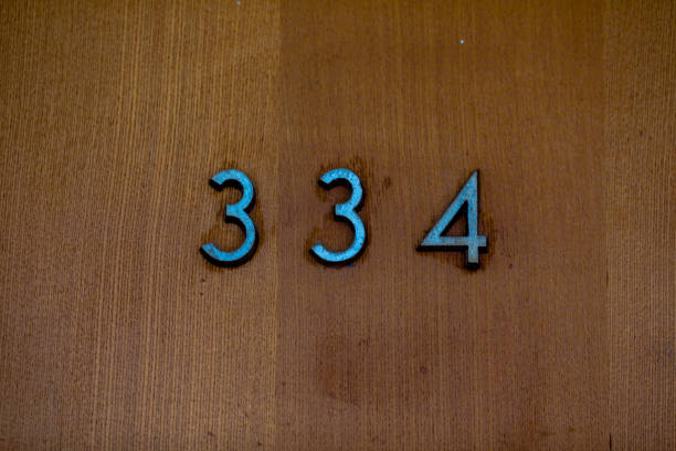 istock figures on a wooden door 914416188