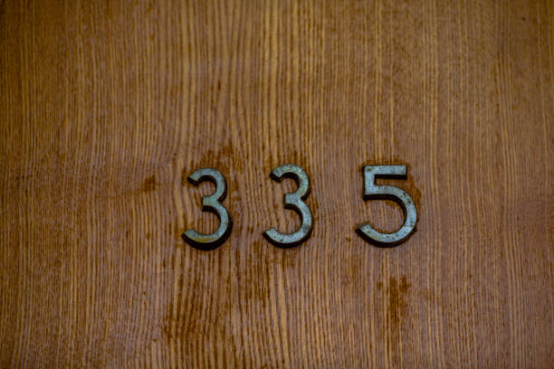 istock figures on a wooden door 914416194