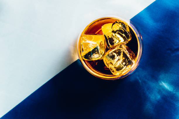 istock Whisky with ice, on Scottish flag 914416864