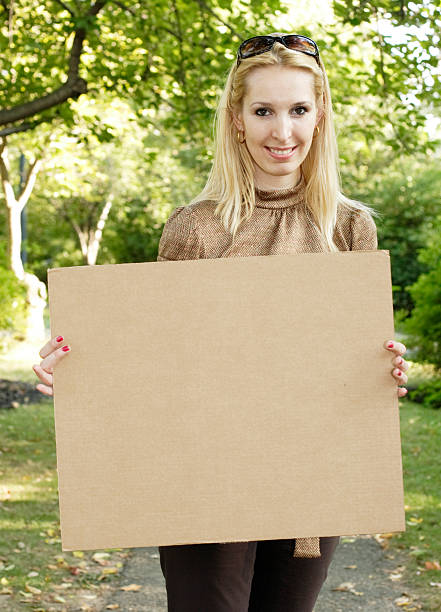 istock Woman with Blank Cardboard Sign 91442014