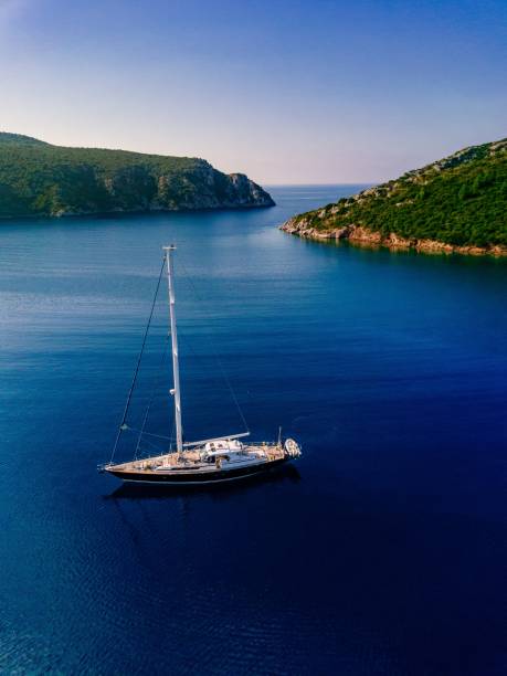 istock Aerial view to Yacht in deep blue sea. 914428404