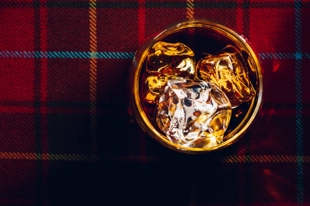 istock Whisky with ice, on tartan 914428456