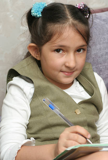 istock The schoolgirl writes a homework 91443231