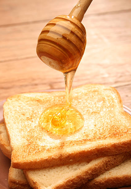 istock Honey pouring over toast bread 91443471