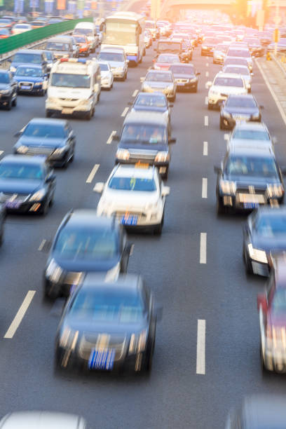 istock Motion blurred car driving on crowded city road in Beijing 914435248