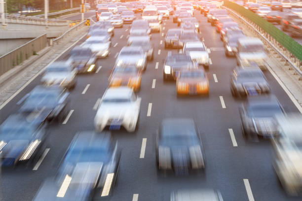 istock Motion blurred car driving on crowded city road in Beijing 914435260