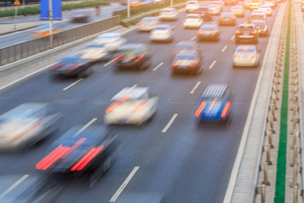 istock Motion blurred car driving on crowded city road in Beijing 914435294