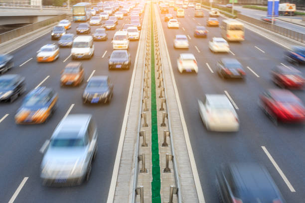 istock Motion blurred car driving on crowded city road in Beijing 914435318