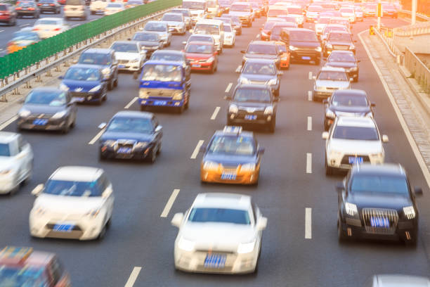 istock Motion blurred car driving on crowded city road in Beijing 914435322
