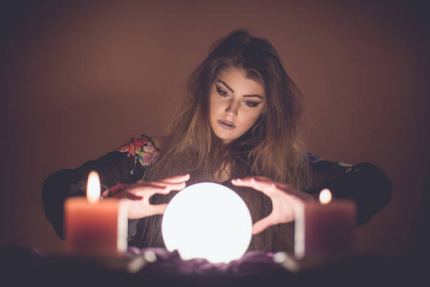 istock Girl with crystal magic ball 914435350