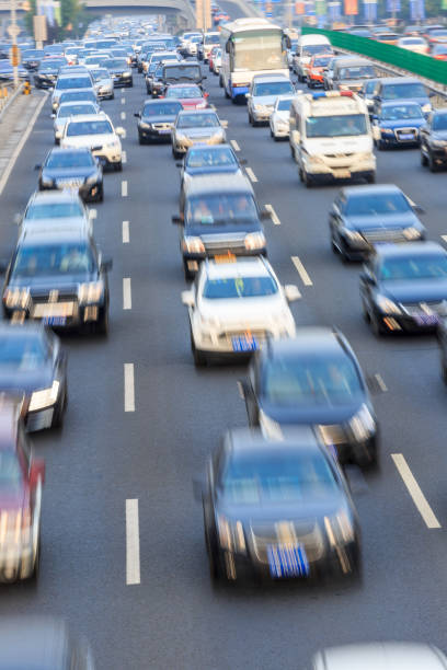 istock Motion blurred car driving on crowded city road in Beijing 914435376