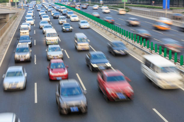 istock Motion blurred car driving on crowded city road in Beijing 914435380