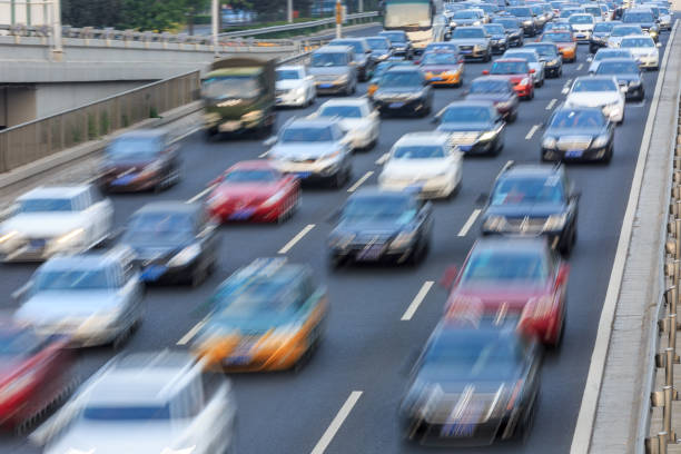 istock Motion blurred car driving on crowded city road in Beijing 914435392