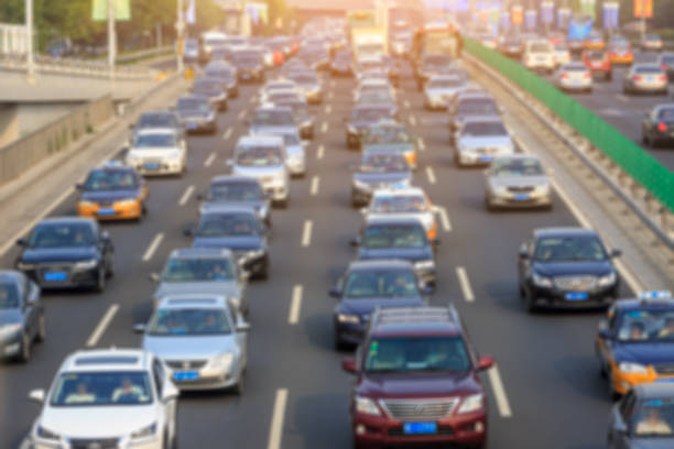 istock blurred car driving on crowded city road in Beijing 914435406