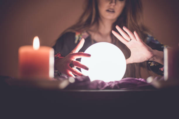 istock Girl with crystal magic ball 914435934