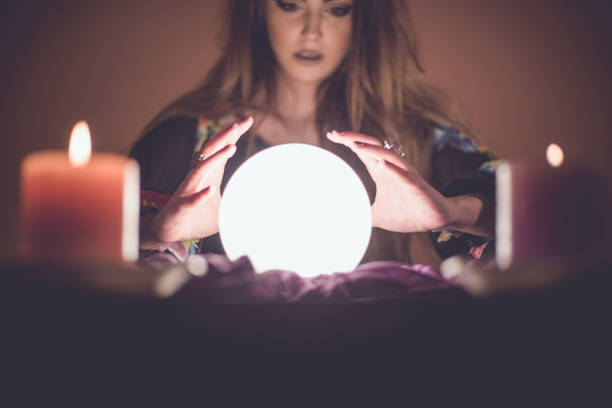 istock Girl with crystal magic ball 914435976