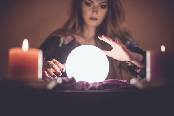 istock Girl with crystal magic ball 914435980