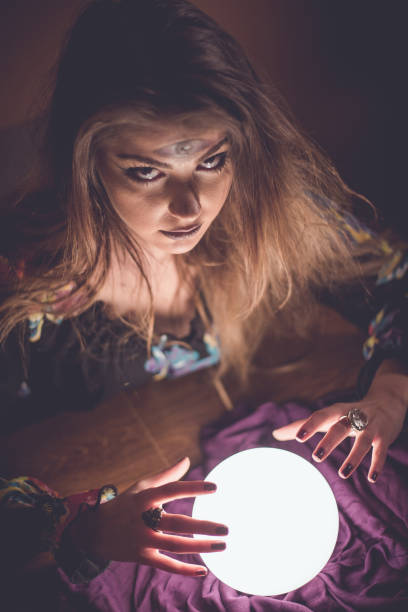 istock Girl with crystal magic ball 914436046