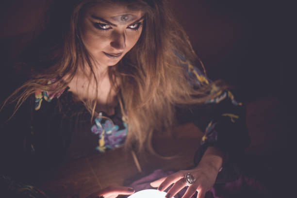 istock Girl with crystal magic ball 914436102