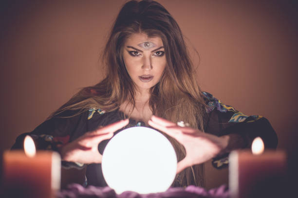 istock Girl with crystal magic ball 914436136