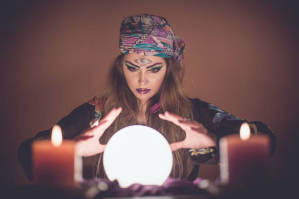 istock Girl with crystal magic ball 914436588