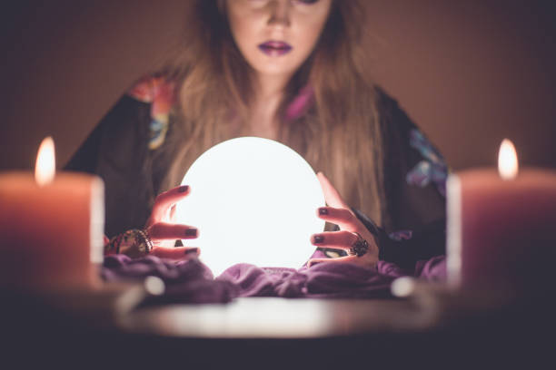 istock Girl with crystal magic ball 914438662