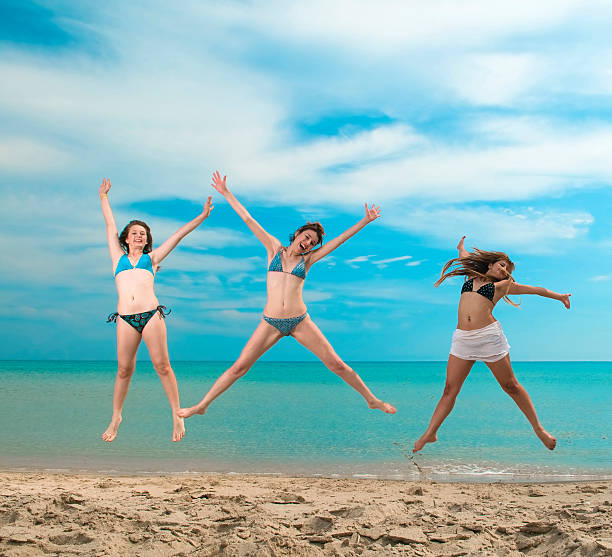 Portrait of girlfriends spending time on the beach