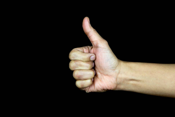 istock Hand Giving Thumbs Up on Black Background 914443000