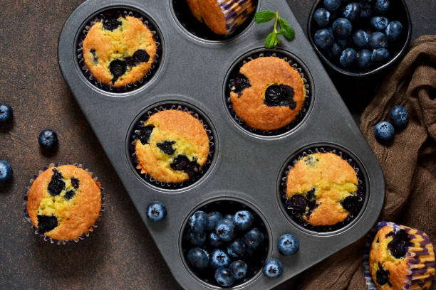 istock Homemade vanilla muffins with blueberries on a dark concrete background.Rustic! 914444202