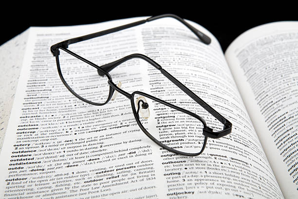 istock dictionary with a pair of glasses on it. 91444695