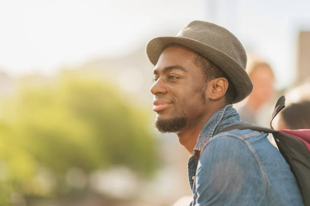istock Confident Smiling Young Man at Pyrmont Bridge in Darling Harbour 914449824
