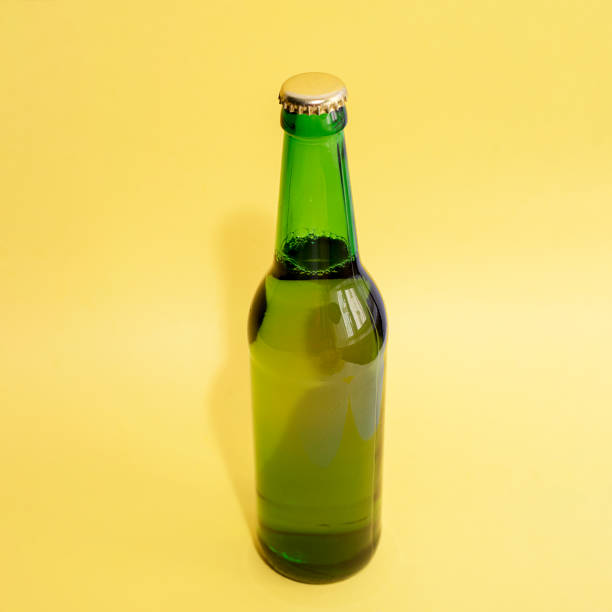 A bottle of beer on a yellow background