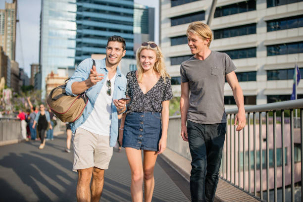 istock Travelling Students in Sydney Checking Directions with Smart Phone 914454274