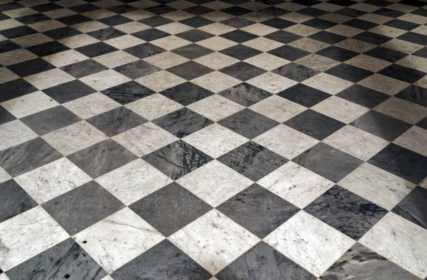 istock Black and white checkered Perspective view floor grunge tiles marble surface decorative stone interior 914454952