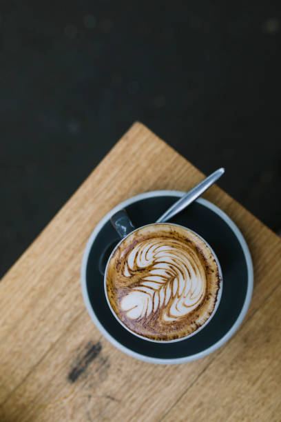 istock Cappuccino on a Wooden Table 914458988