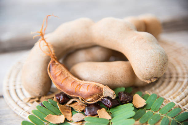 istock Close up tamarind on wood texture. 914459540